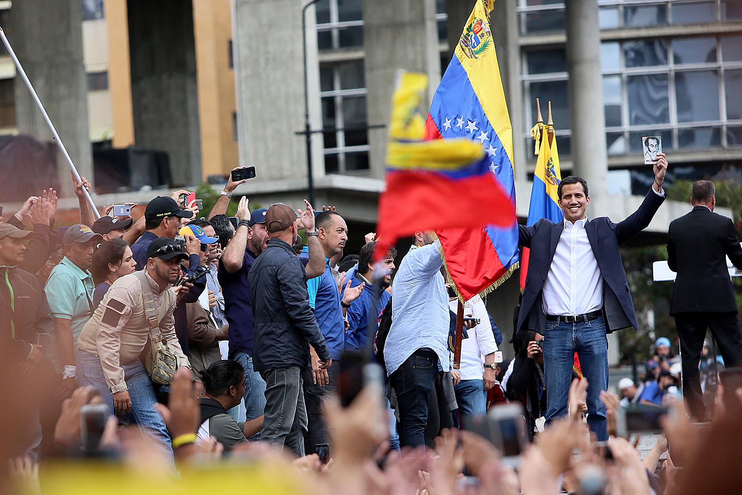 Venezuelan opposition leader and head of the National Assembly Juan Guaido declares self interim president as thousands of people protest against Nicolás Maduro on January 23, 2019 in Caracas, Venezuela. 