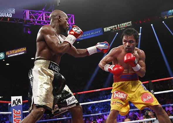 Floyd Mayweather Jr. exchange punches with Manny Pacquiao.