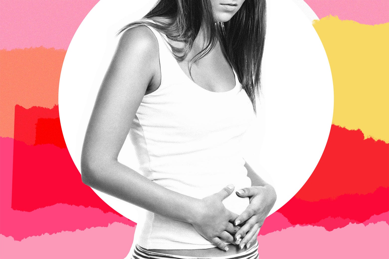 A woman places her hands on her stomach like she could have indigestion—or be pregnant.