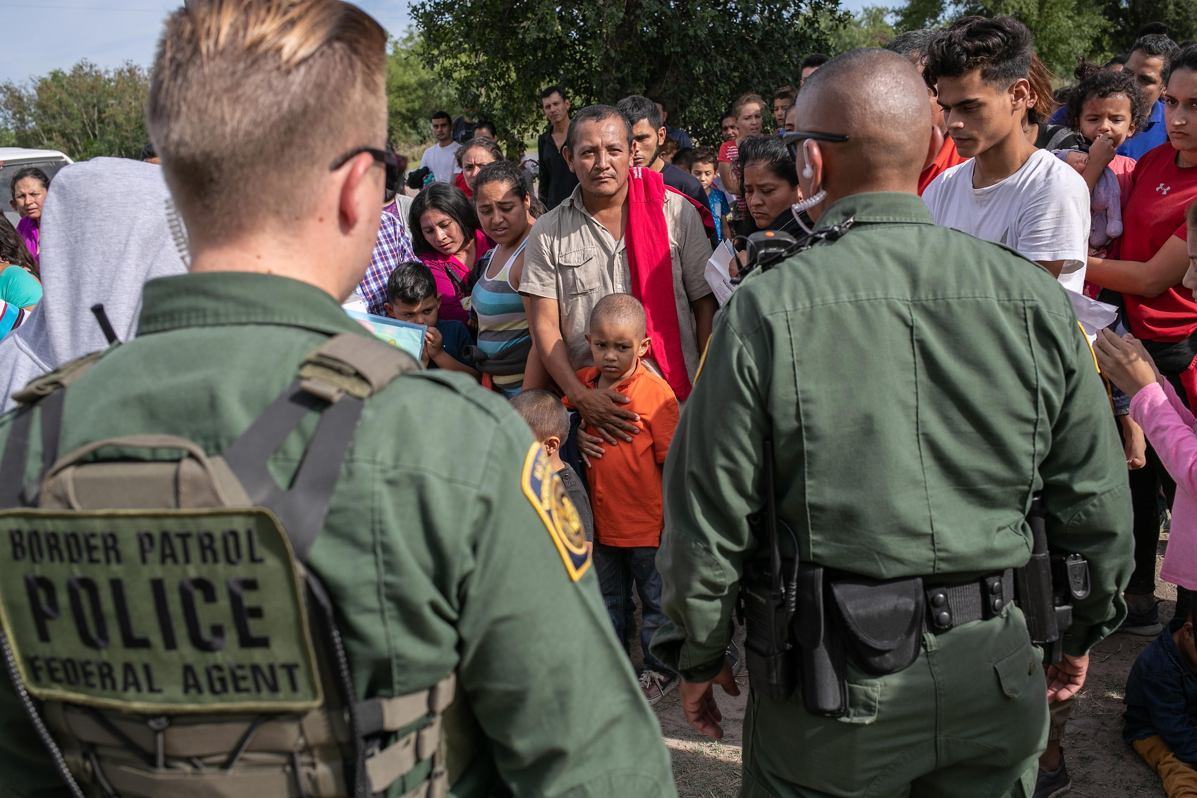 U.S. Border Patrol agents take immigrants into custody on July 02, 2019 in Los Ebanos, Texas. 