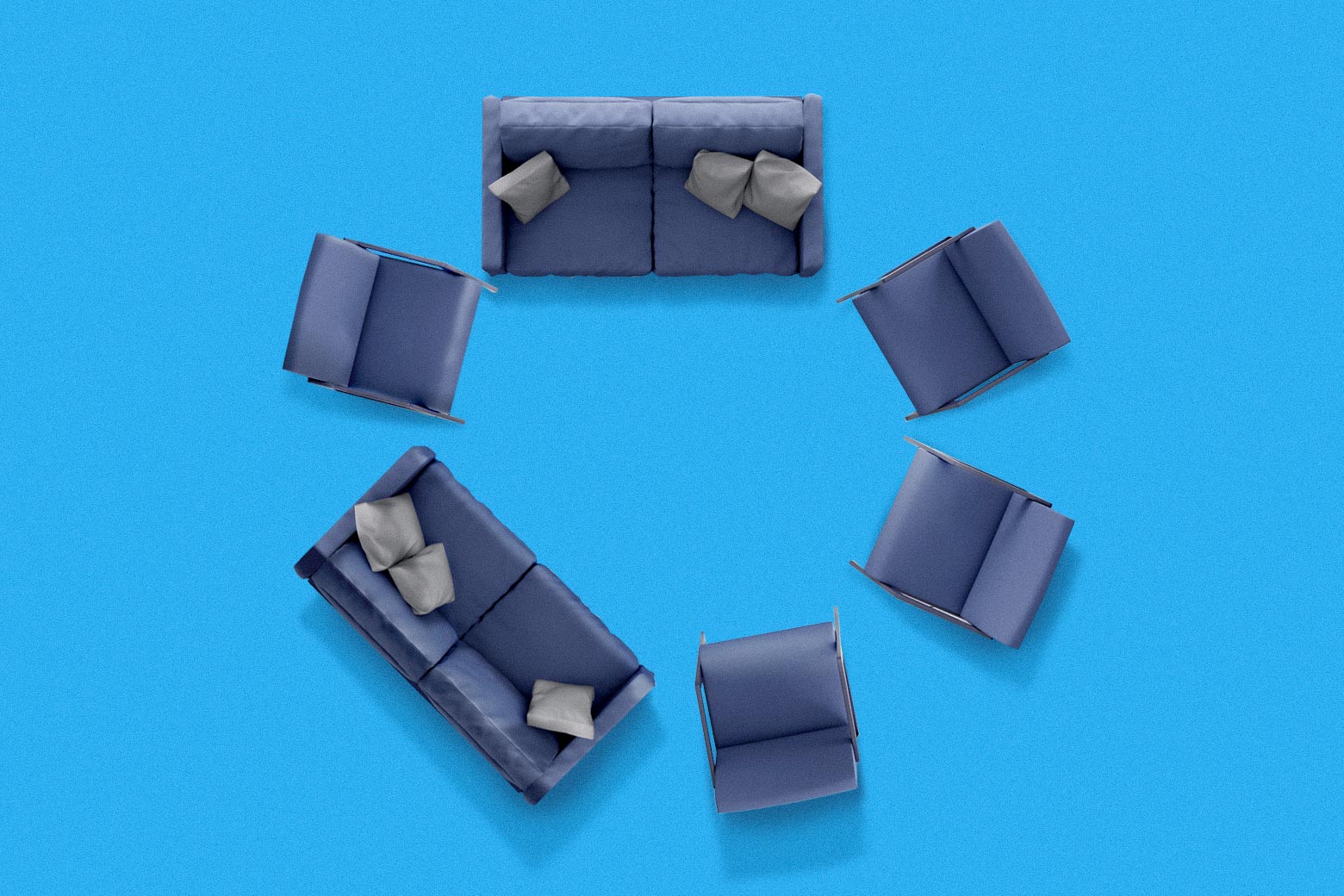 Blue sofas and sofa chairs are arranged in a discussion circle against a blue backdrop.  
