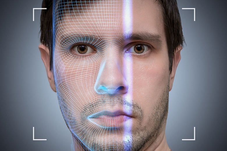 A face of a young man being biometrically scanned.