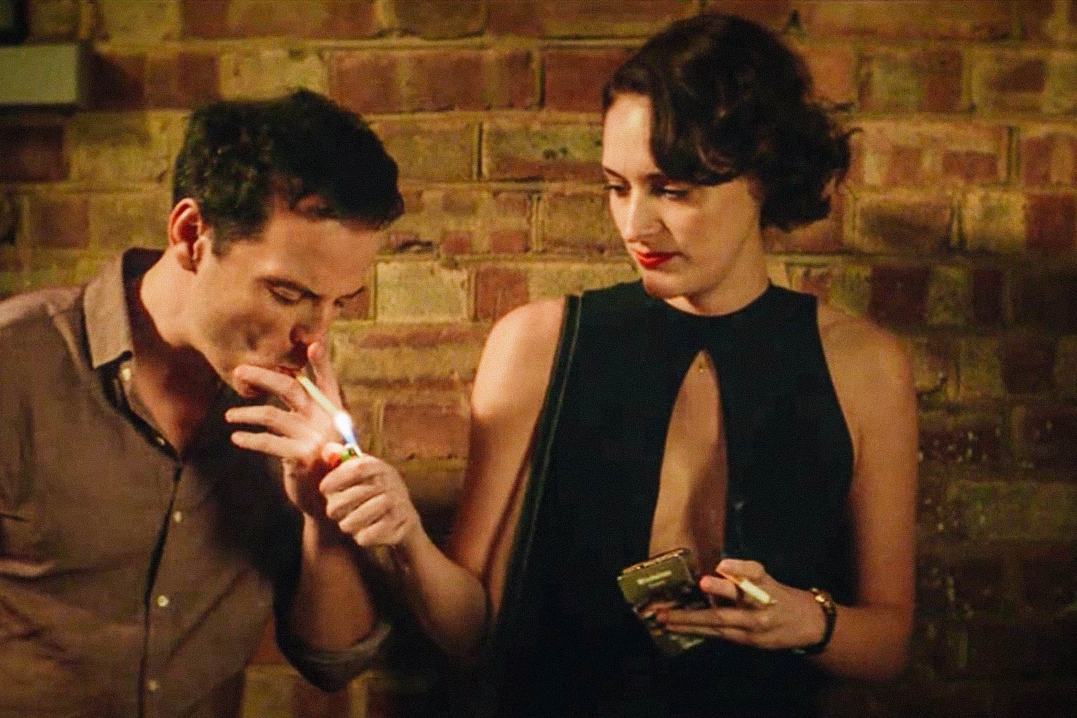 Phoebe Waller-Bridge lights a man's cigarette in a still from Fleabag.