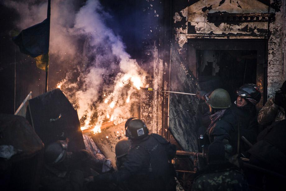 Demonstrators clash with riot police in central Kiev on Feb. 18, 2014. 
