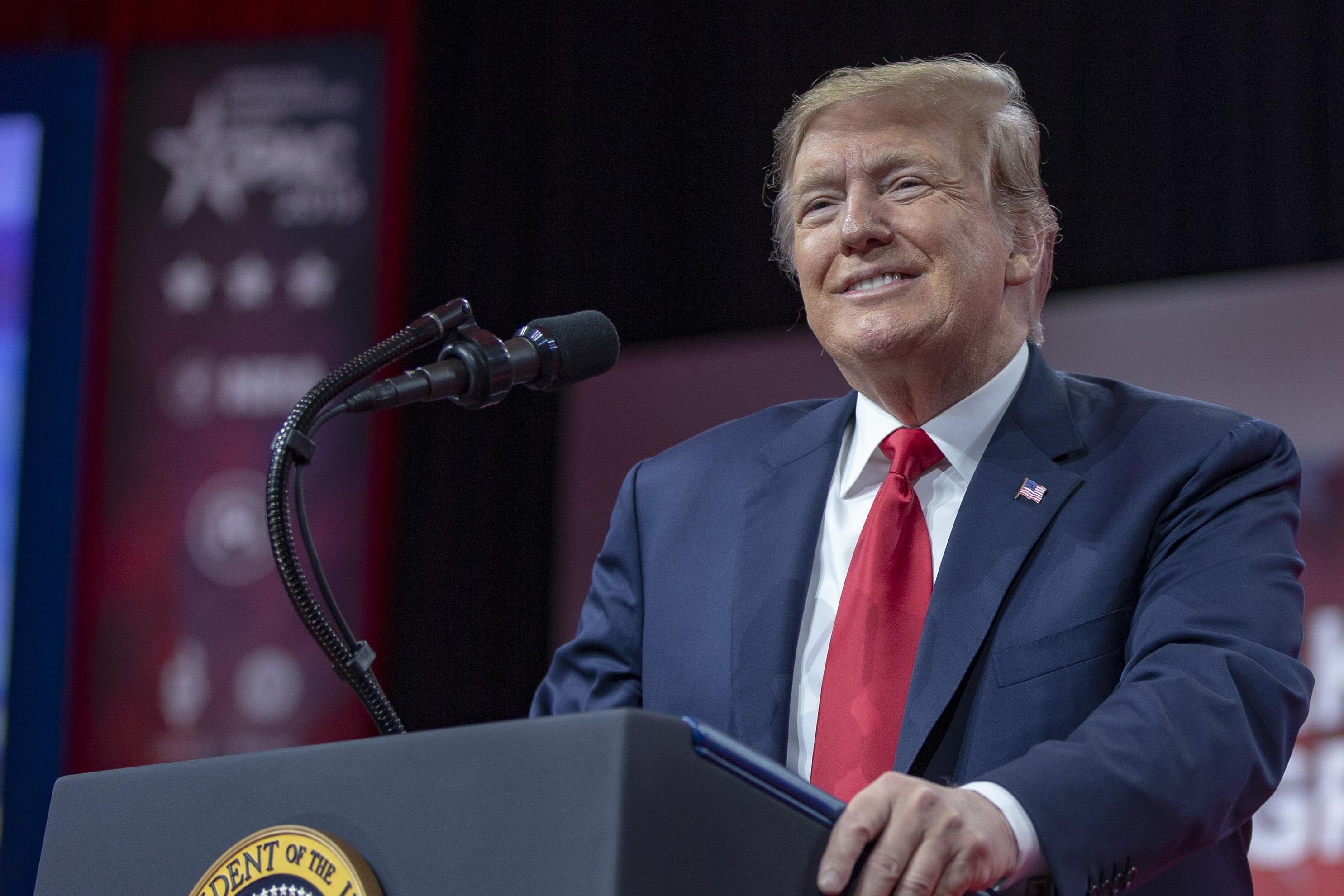 President Donald Trump smiling during a speech