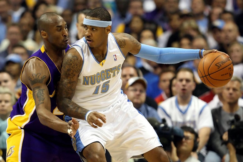 Carmelo Anthony of the Nuggets posts up Kobe Bryant of the Lakers