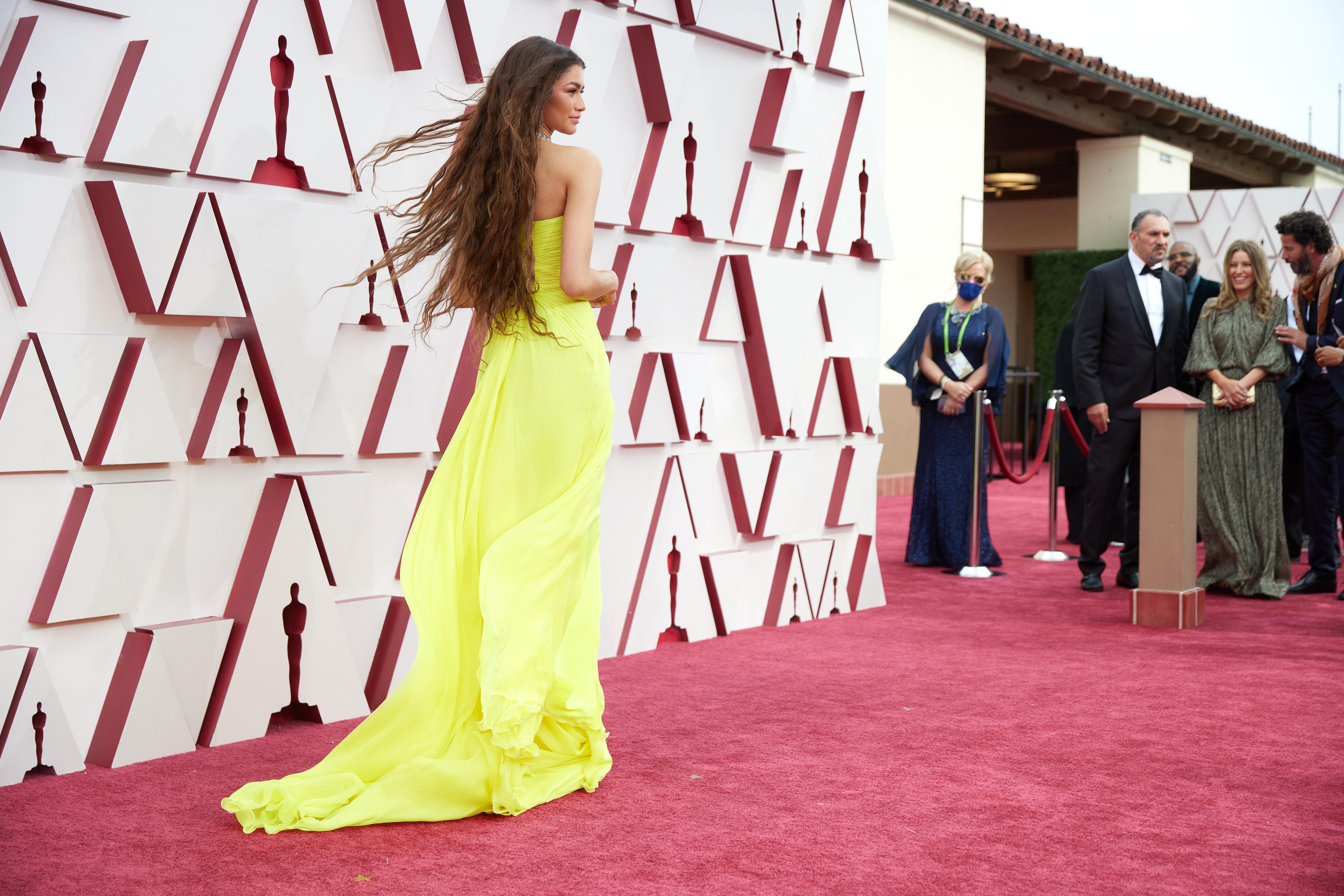 Oscars 2024: Liza Koshy falls on red carpet while walking in 20cm heels -  NZ Herald