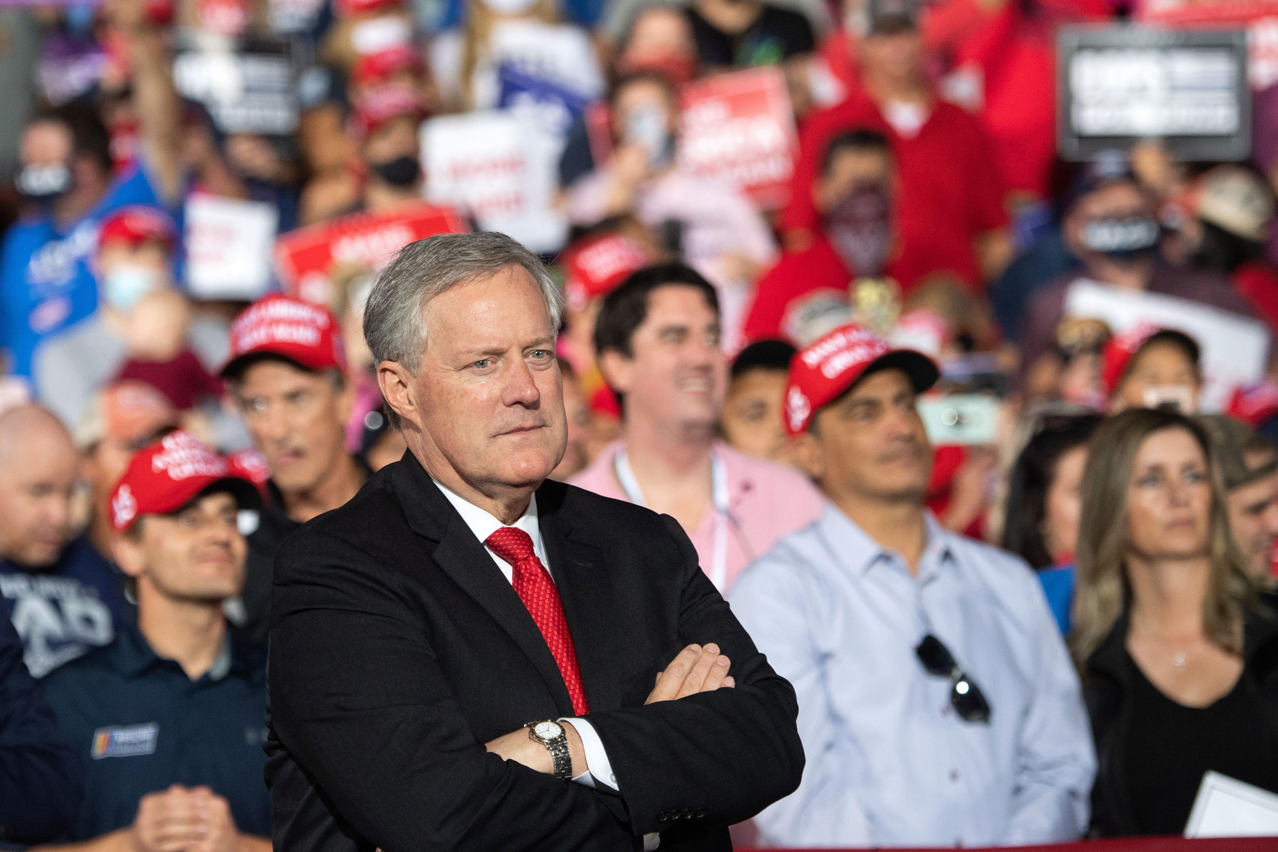 Then-White House Chief of Staff Mark Meadows listens as Donald Trump holds a rally as he campaigns in Gastonia, North Carolina, October 21, 2020. 