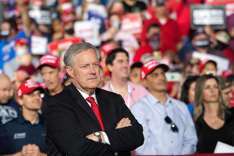 Then-White House Chief of Staff Mark Meadows listens as Donald Trump holds a rally as he campaigns in Gastonia, North Carolina, October 21, 2020. 