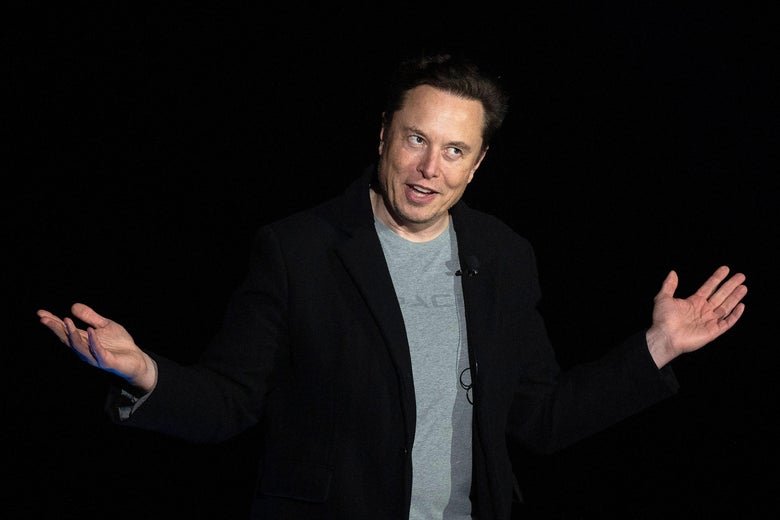 Elon Musk gestures as he speaks during a press conference.