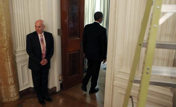 Obama leaves the East Room after his press conference and shuts the door on a carbon tax.