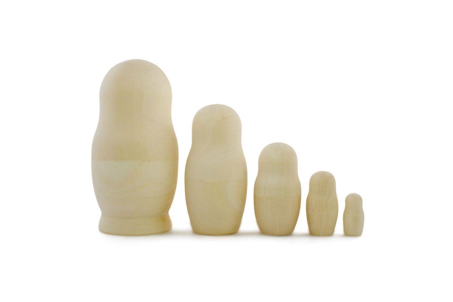 Unpainted wooden nesting dolls.