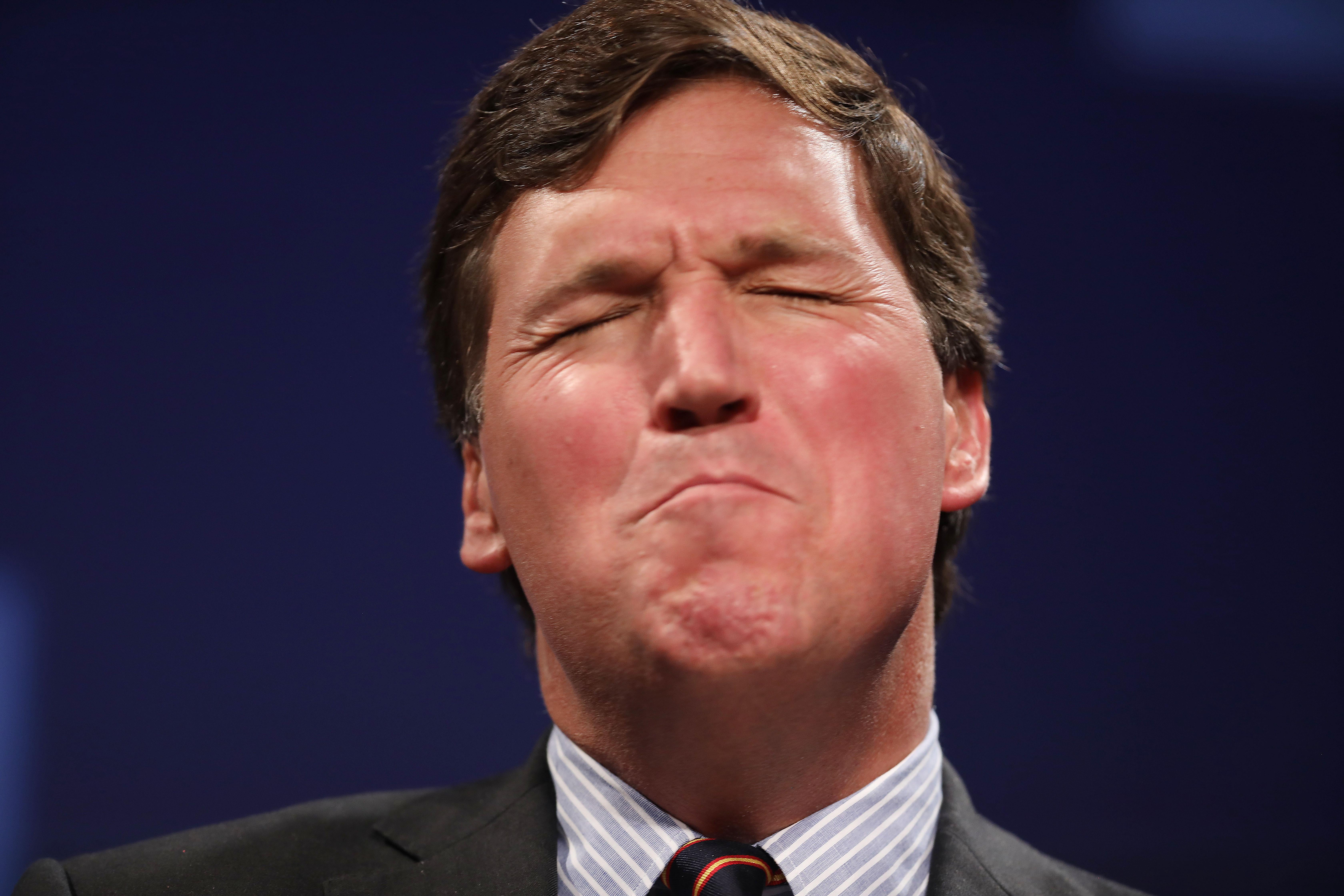 Tucker Carlson, red in the face.
