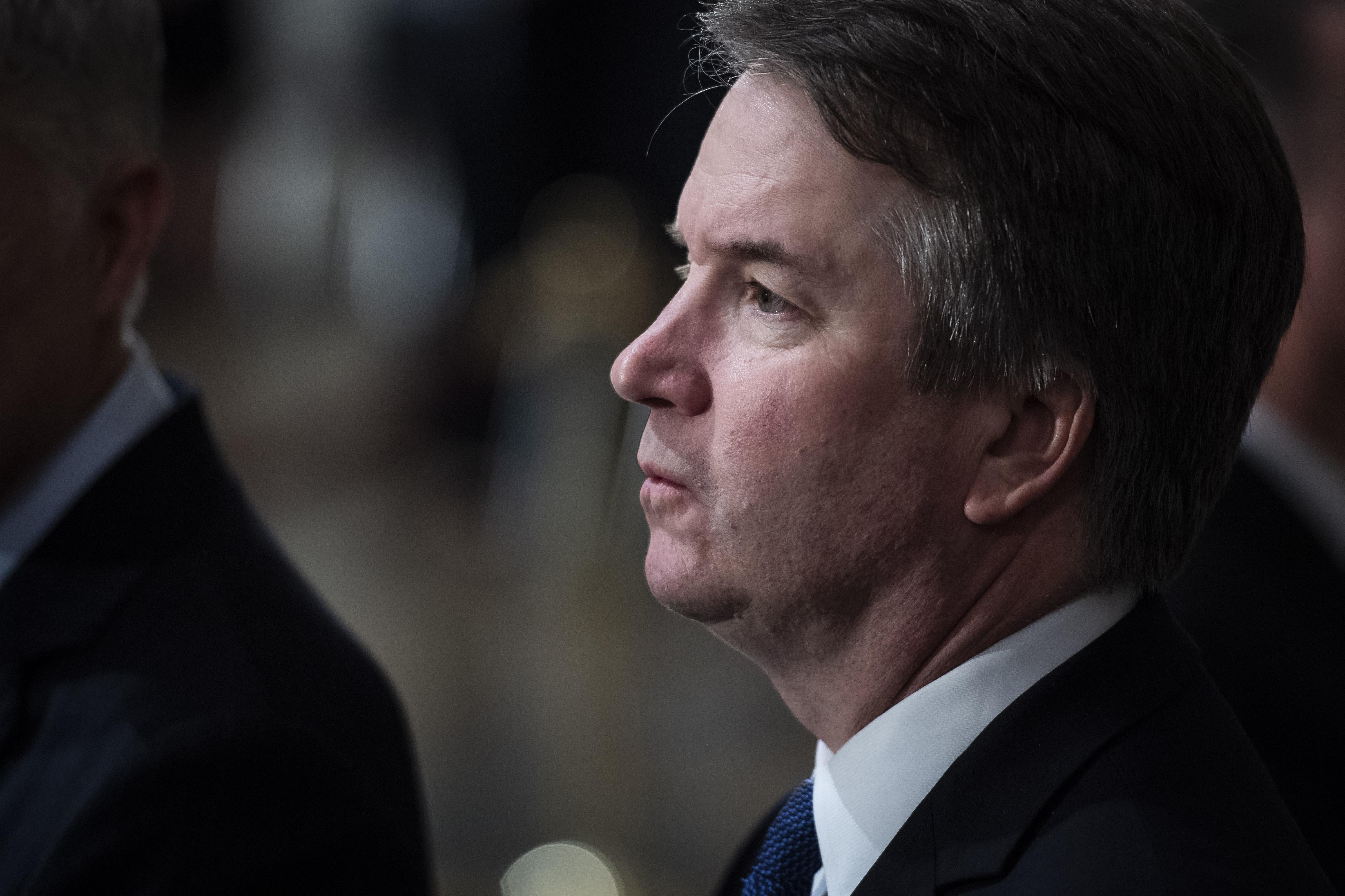 A close-up of Kavanaugh staring grimly.