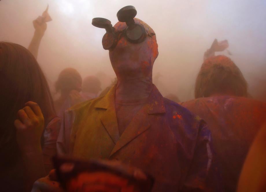 Participants dance and throw colored chalk during the Holi Festival of Colors at the Sri Sri Radha Krishna Temple in Spanish Fork, Utah on March 30, 2013.