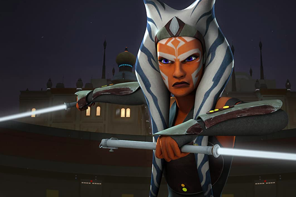 In a 3D animated style, Ahsoka Tano, now with longer head-tails and a more elongated face, poses with two white lightsabers.