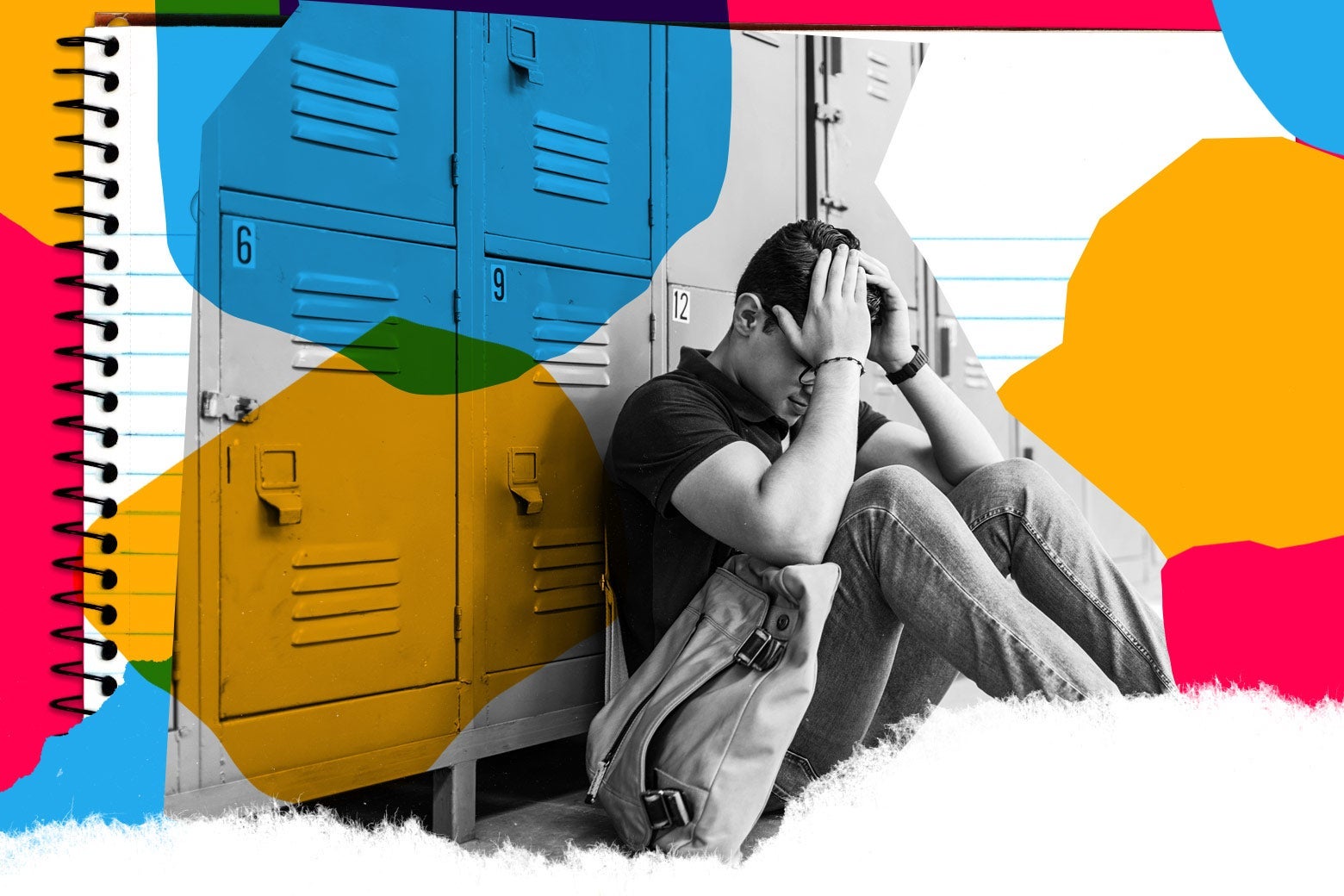 A teenager sits against a row of lockers with his head in his hands.