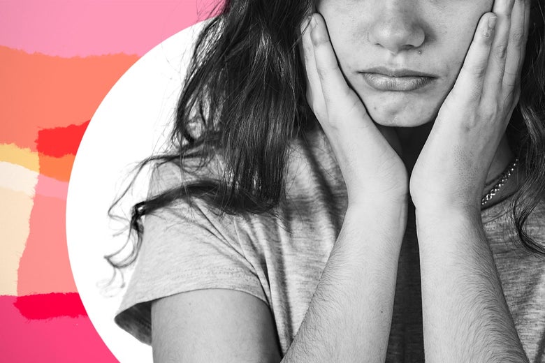 Teen girl looking sad with her hands on either side of her face.