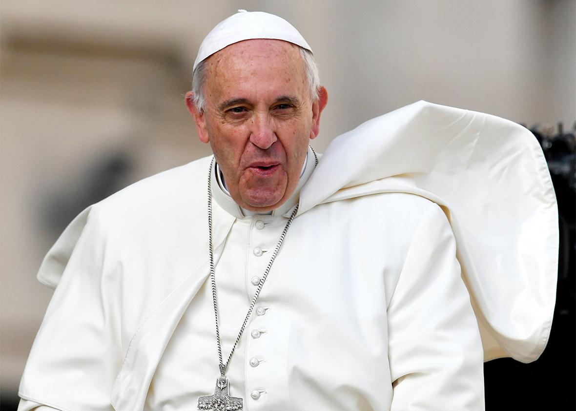 Pope Francis grimaces upon his arrival in St. Peter' Square for his weekly general audience at Vatican on April 6, 2016. 