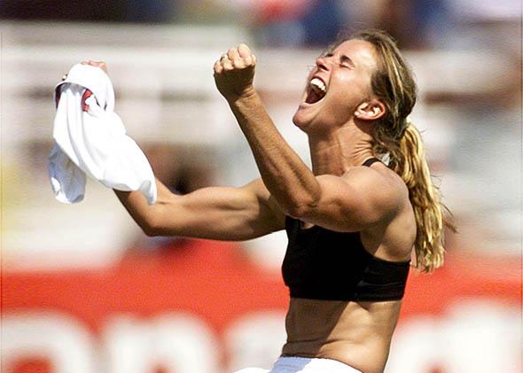 Brandi Chastain of the US celebrates after kicking the winning p