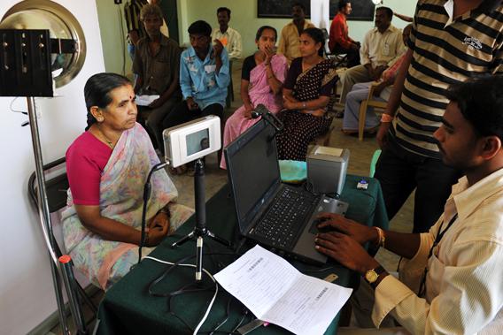 An Indian villager looks at an iris scanner during the data collecting process for a pilot project of The Unique Identification Authority of India (UIDAI) in the village of Chellur, some 145kms north-west of Bangalore on April 22, 2010.   