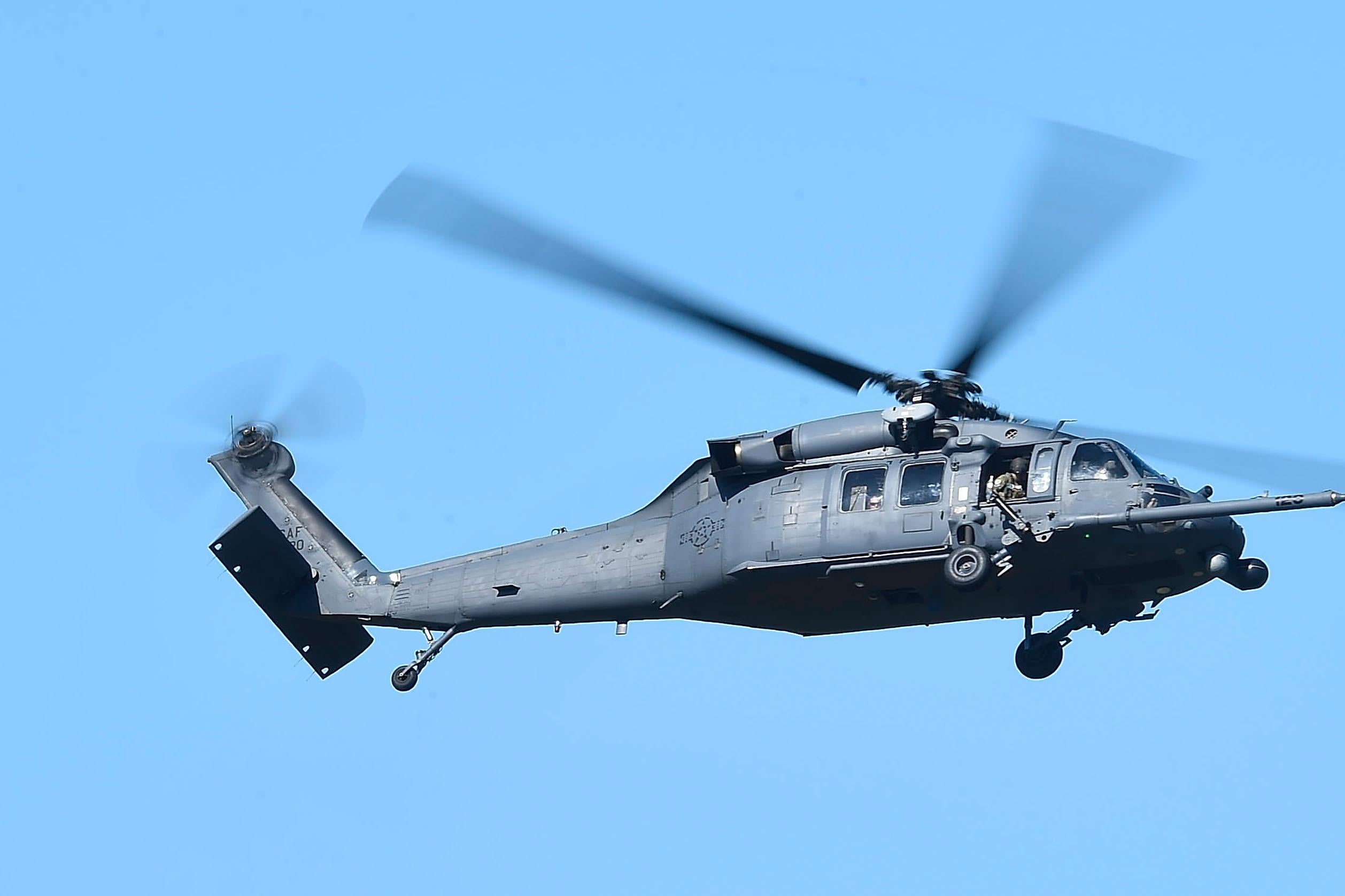 A U.S military HH-60 Pave Hawk Helicopter is seen flying over a simulated crash site during Exercise Angel Reign on July 1, 2016 in Townsville, Australia. 