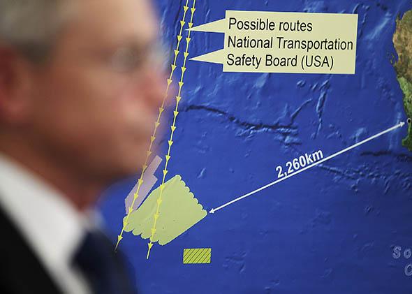 Australian Maritime Safety Authority Emergency Response Division General Manager John Young speaks to the media about satellite imagery of objects possibly related to the search for Malaysian Airlines flight MH370 March 20, 2014 in Canberra, Australia. 