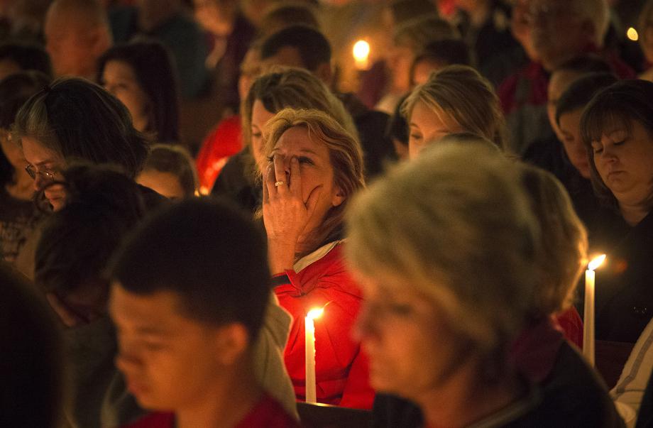 A woman mourns during a candle light church service at St Mary's for victims of a fertilizer plant explosion in the town of West, near Waco, Texas April 18, 2013. 