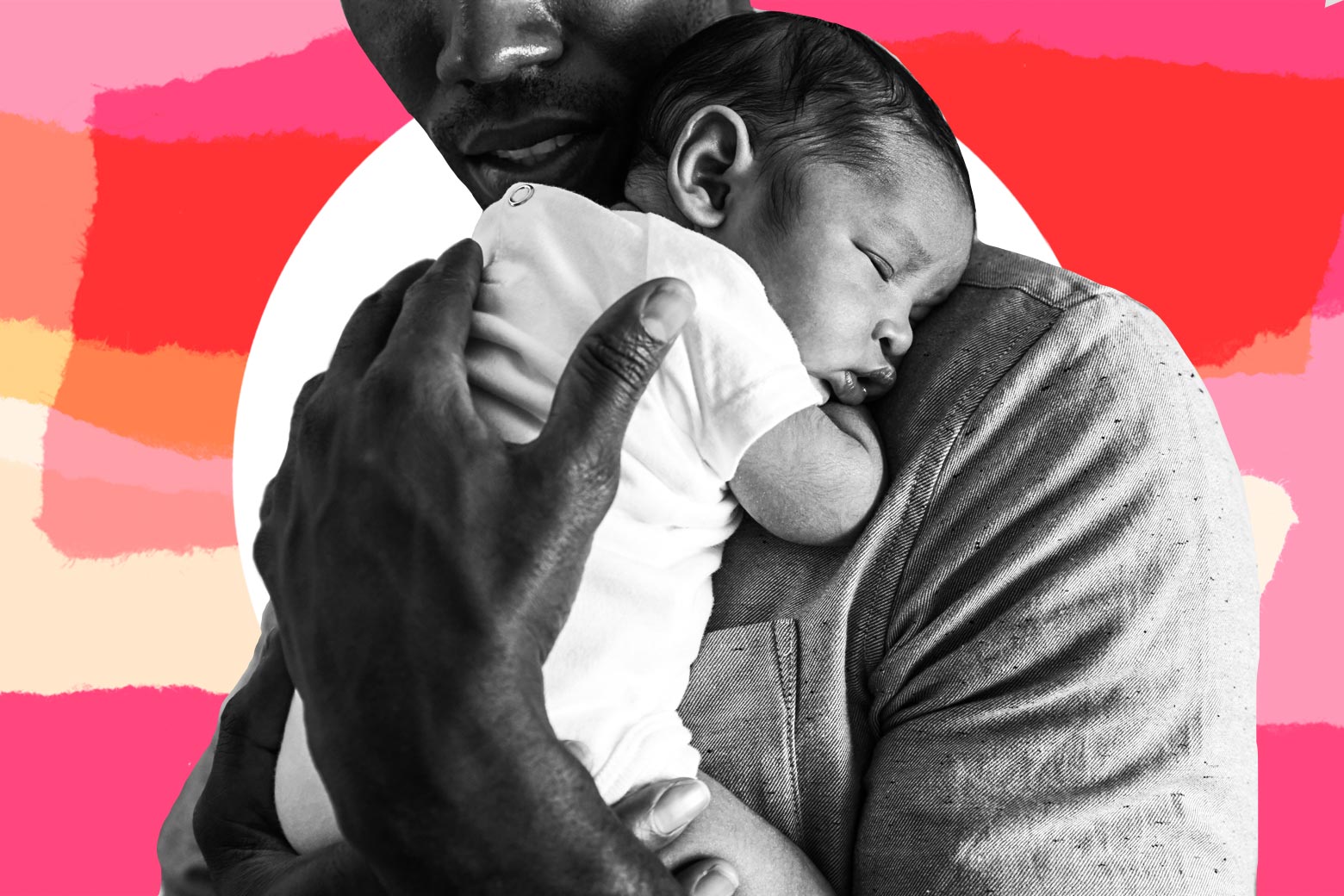 A father holds a sleeping baby to his chest