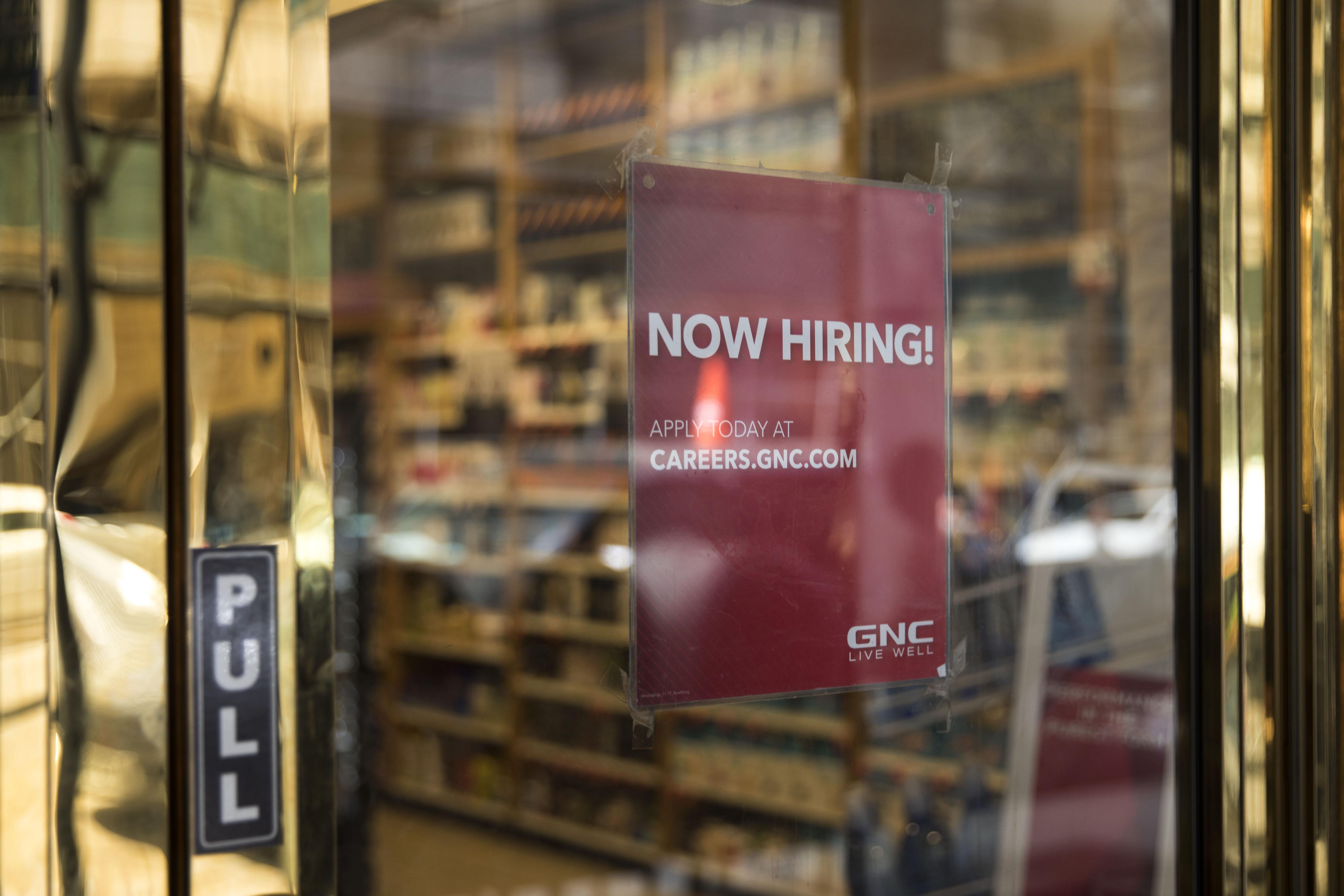 NEW YORK, NY - MAY 4: A 'now hiring' sign hangs on the door of a GNC Nutrition store in Lower Manhattan, May 4, 2018 in New York City. U.S. unemployment fell to a near historic low of 3.9 percent and hiring remained strong in April. The Dow finished up over 300 points at the close on Friday. (Photo by Drew Angerer/Getty Images)