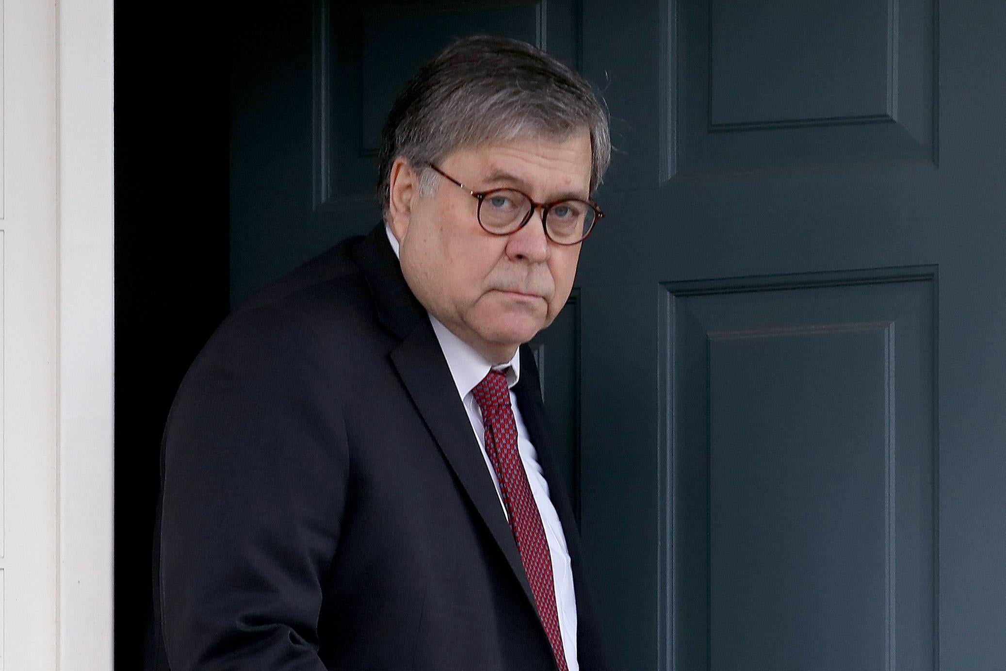U.S. Attorney General William Barr departs his home on Friday in McLean, Virginia.