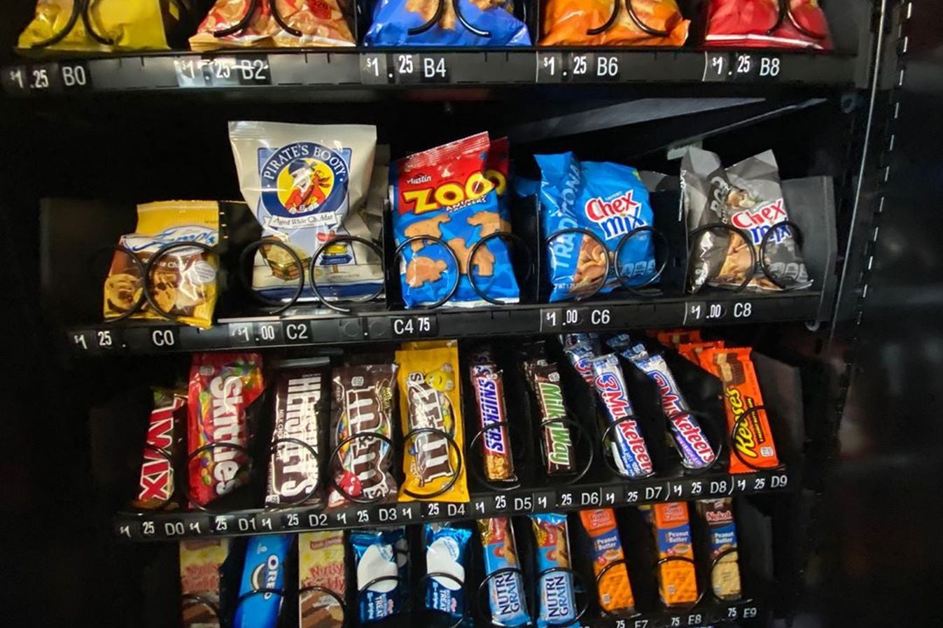 Vending machine filled with a variety of snacks and candy