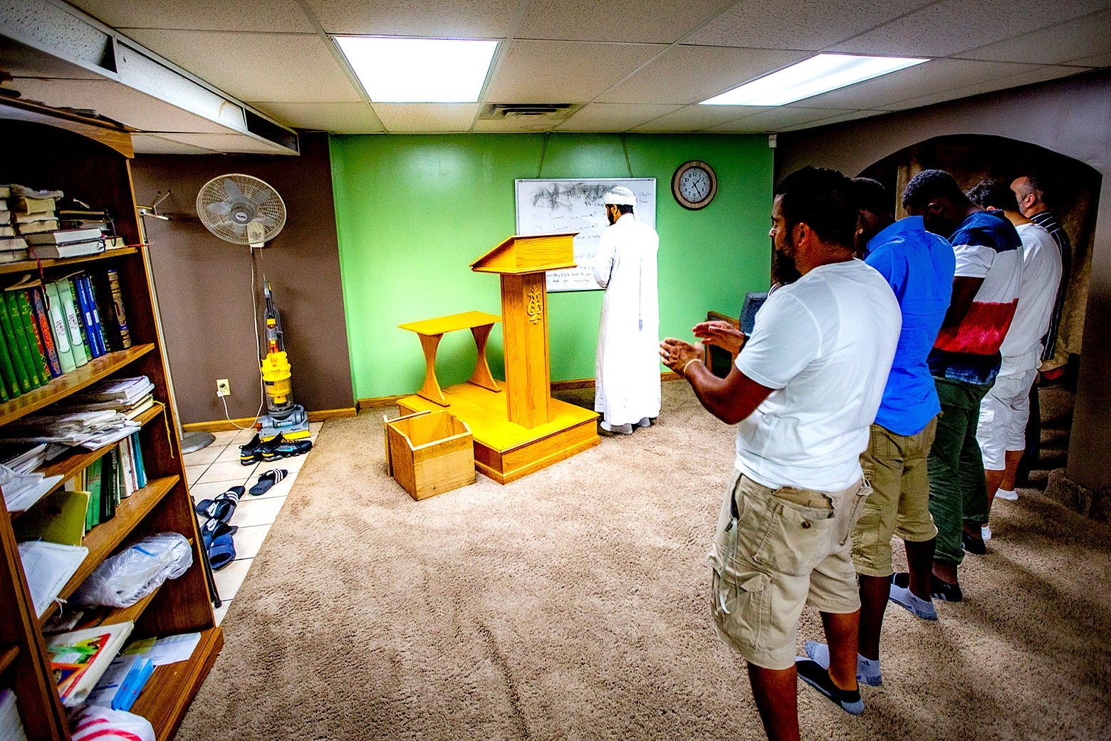Men pray in CUP Foods' basement mosque.