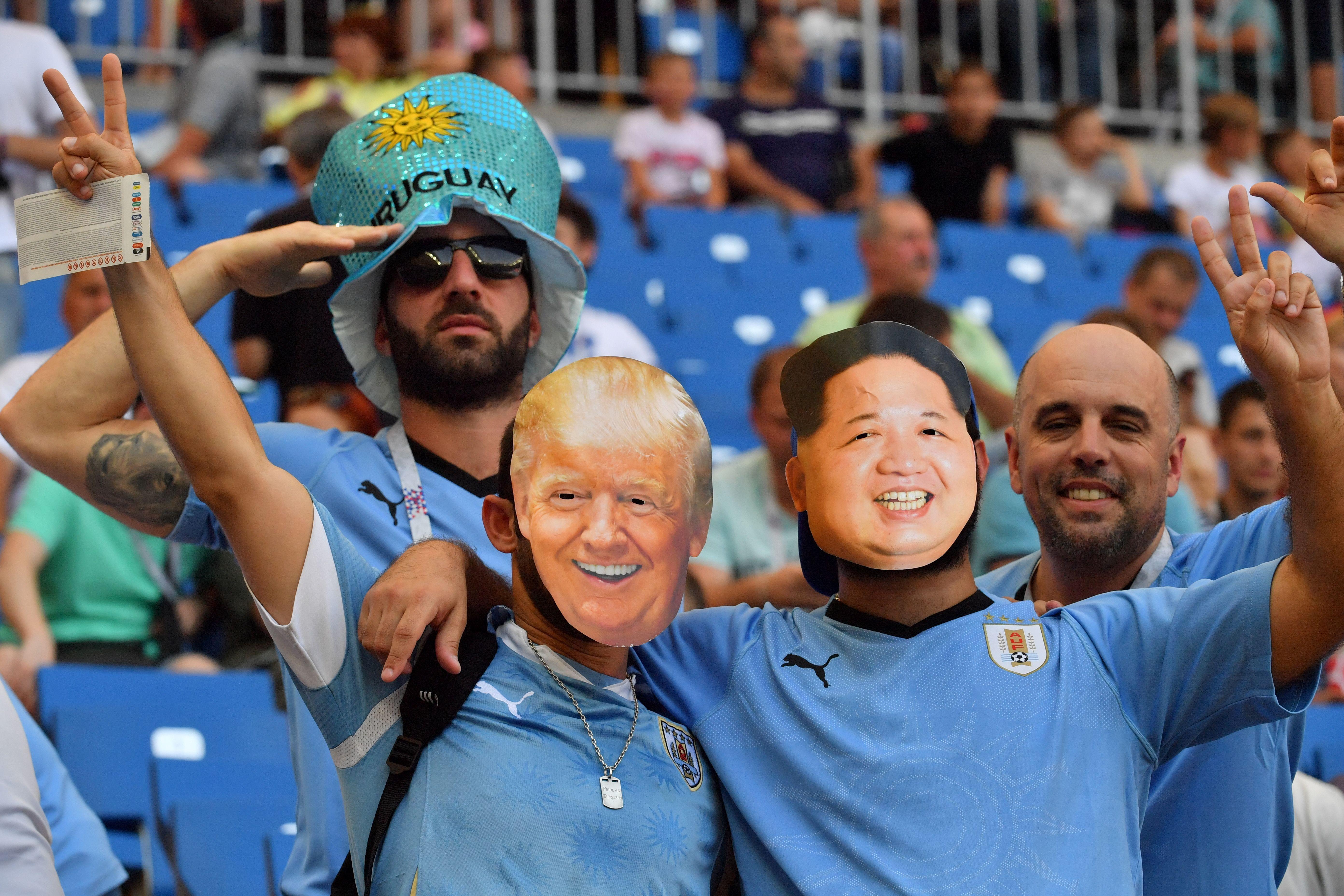 Uruguay fans with paper masks of U.S. President Donald Trump and North Korean leader Kim Jong-un are seen in the crowd ahead of the 2018 World Cup Uruguay–Saudi Arabia match on June 20.