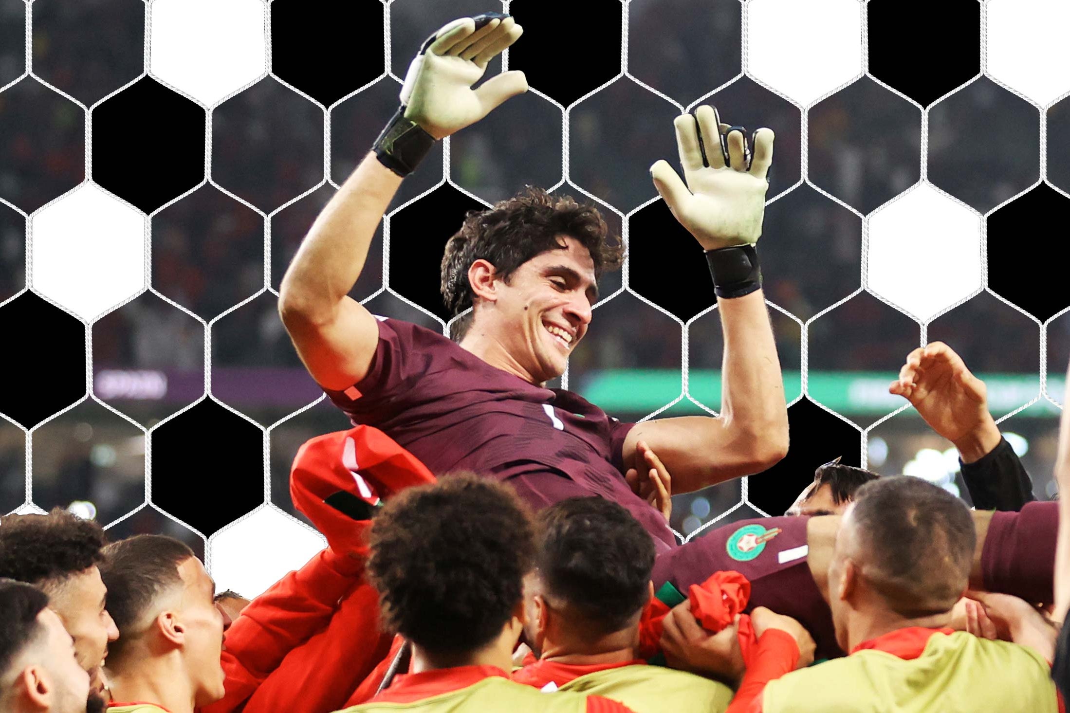 Morocco players hold their goalie above their heads in celebration