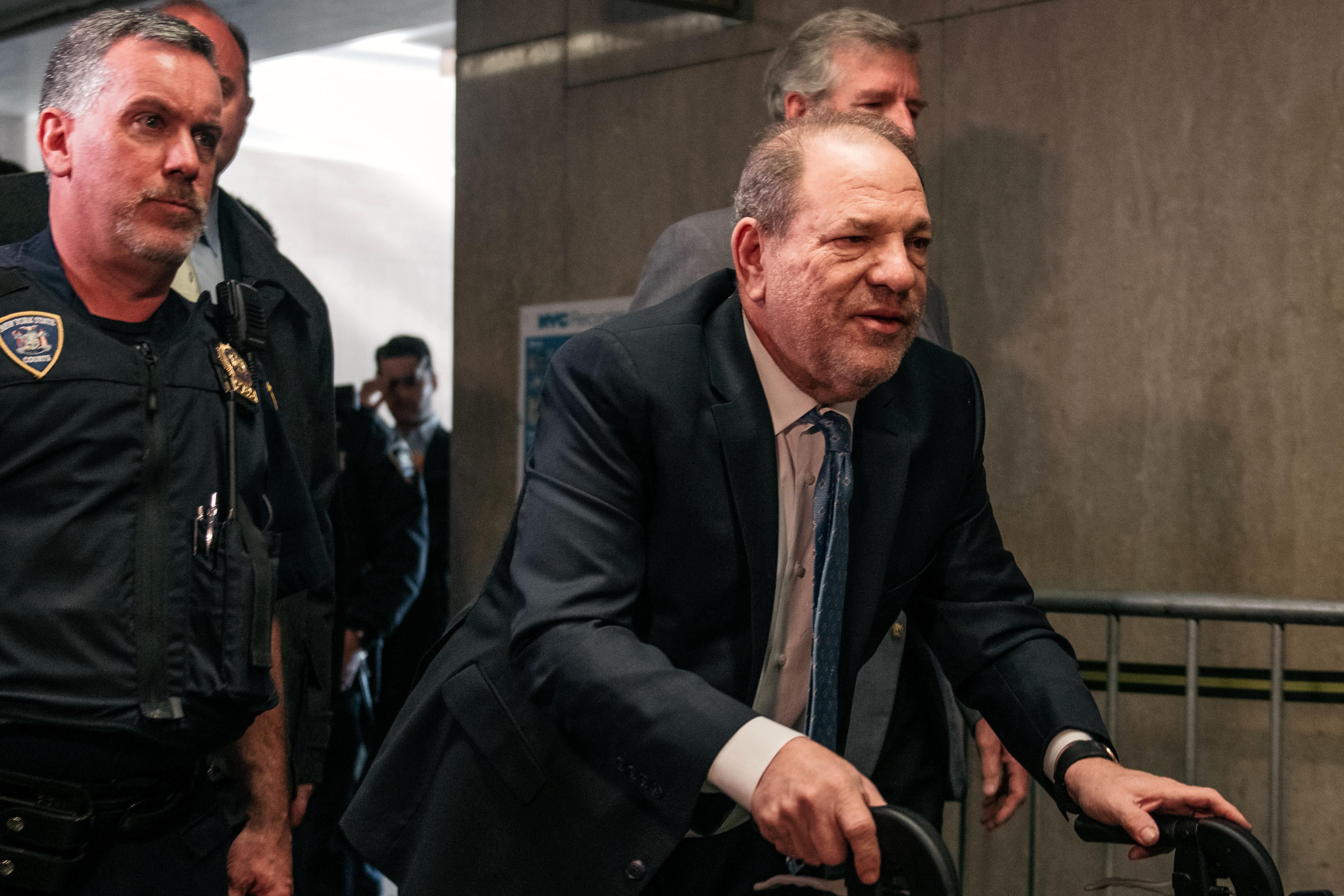 Harvey Weinstein walks into court with a walker.  