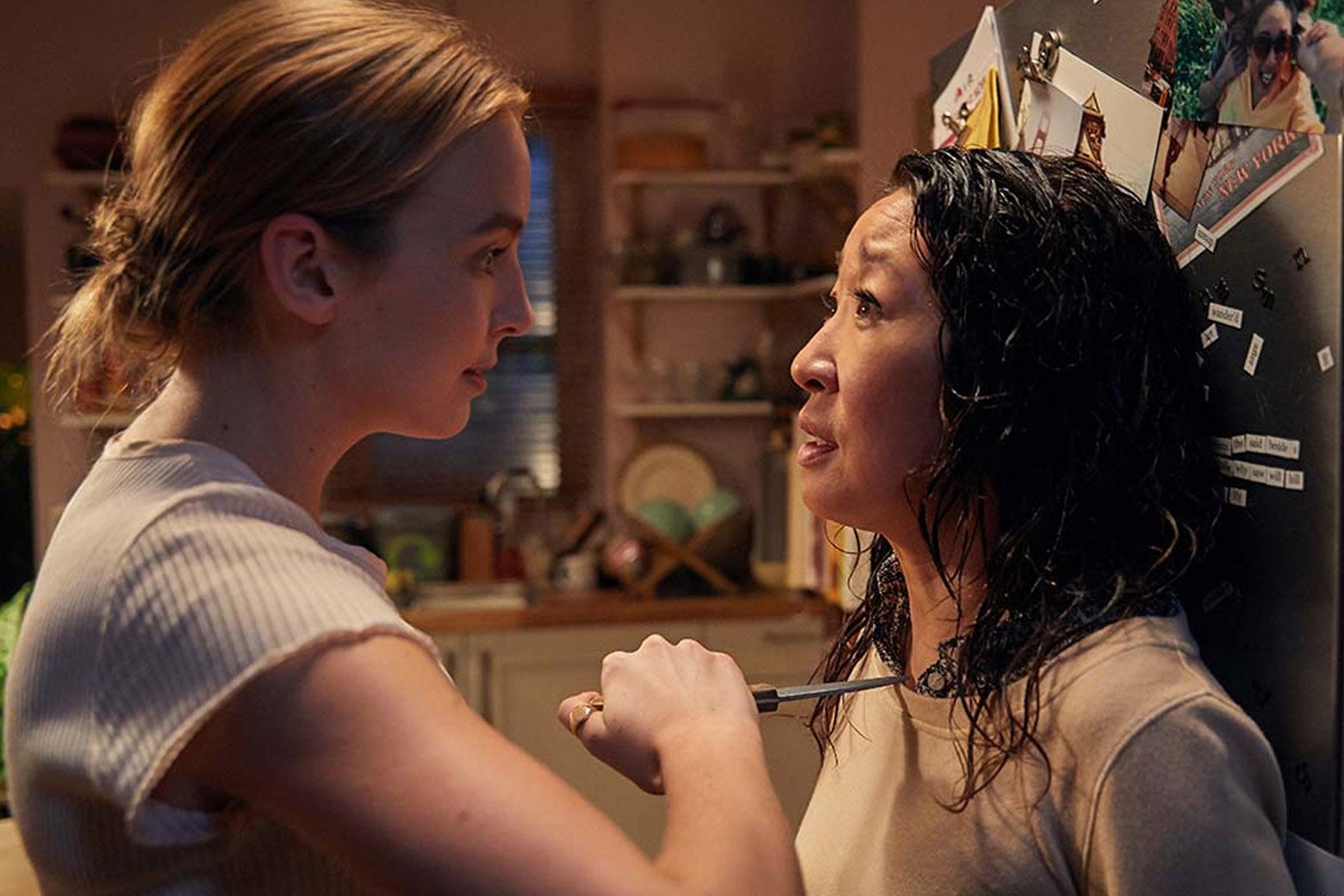 Jodie Comer holds a knife to Sandra Oh’s chest in a still from Killing Eve.