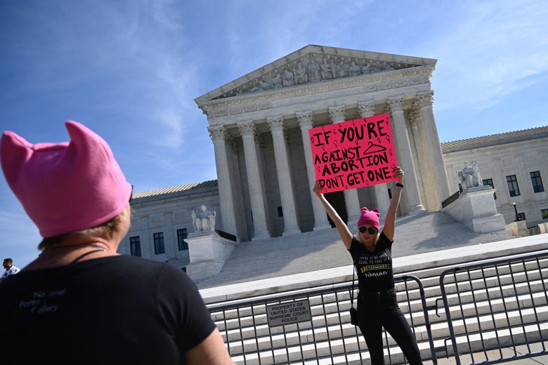 A protester holds a sign in front of the Supreme Court during the Women's March and Rally for Abortion Justice in Washington, D.C. on October 2, 2021. 