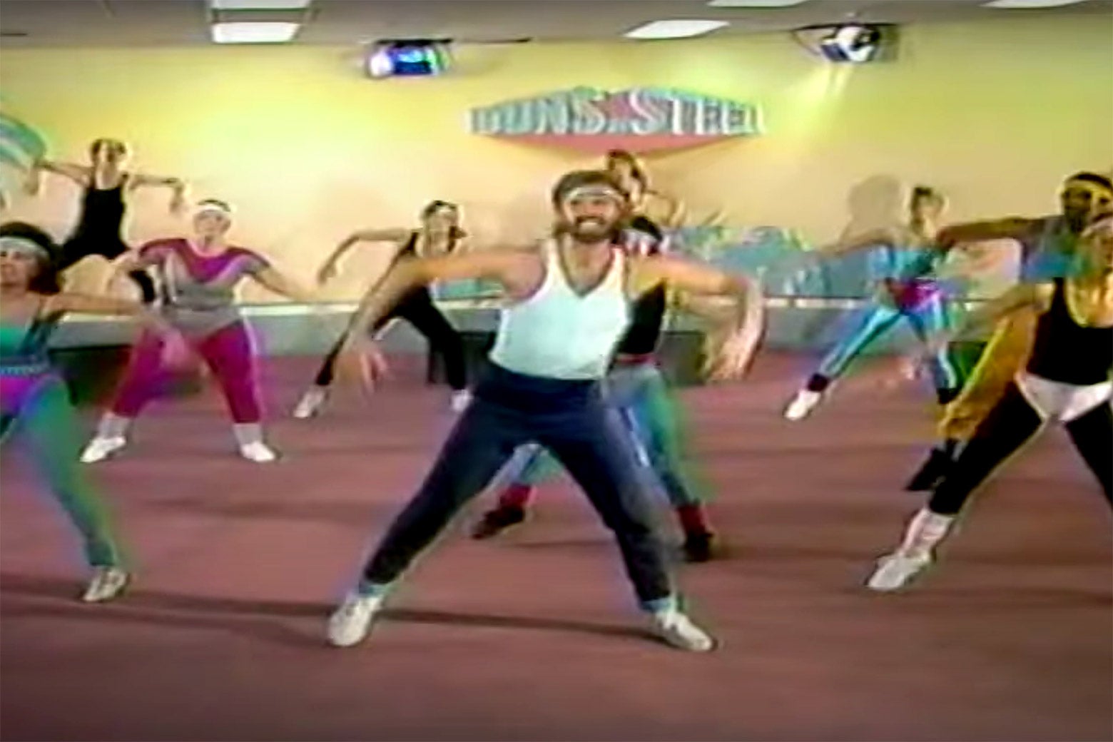 A still from the 1980s workout video Buns of Steel with several people exercising.
