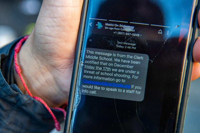 A mother in Chelsea, Massachusetts, shows a text she received explaining her child's school is under the threat of a school shooting on December 17, 2021.