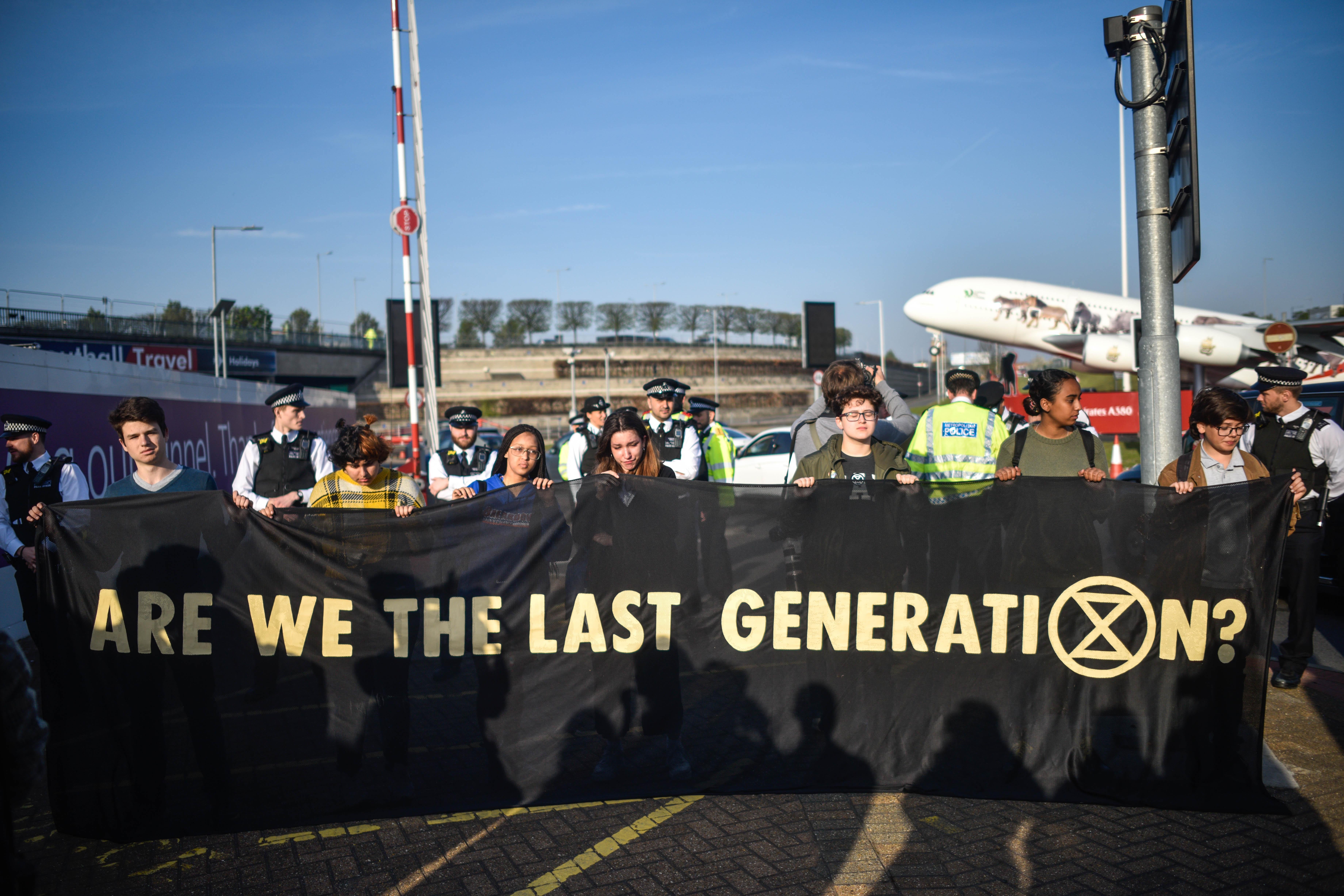 Climate protestors hold a demonstration outside Heathrow Airport.