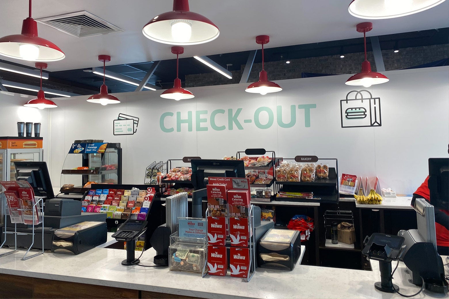 Wawa interior: check-out area with cash registers.