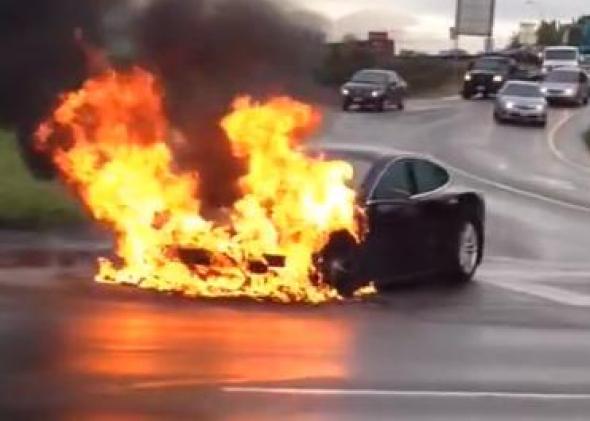 A Tesla Model S' battery burns by the side of a freeway in a Seattle suburb.