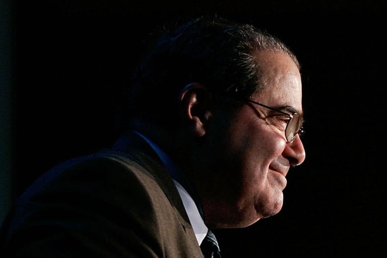 Supreme Court Justice Antonin Scalia smiles as speaks at an event.