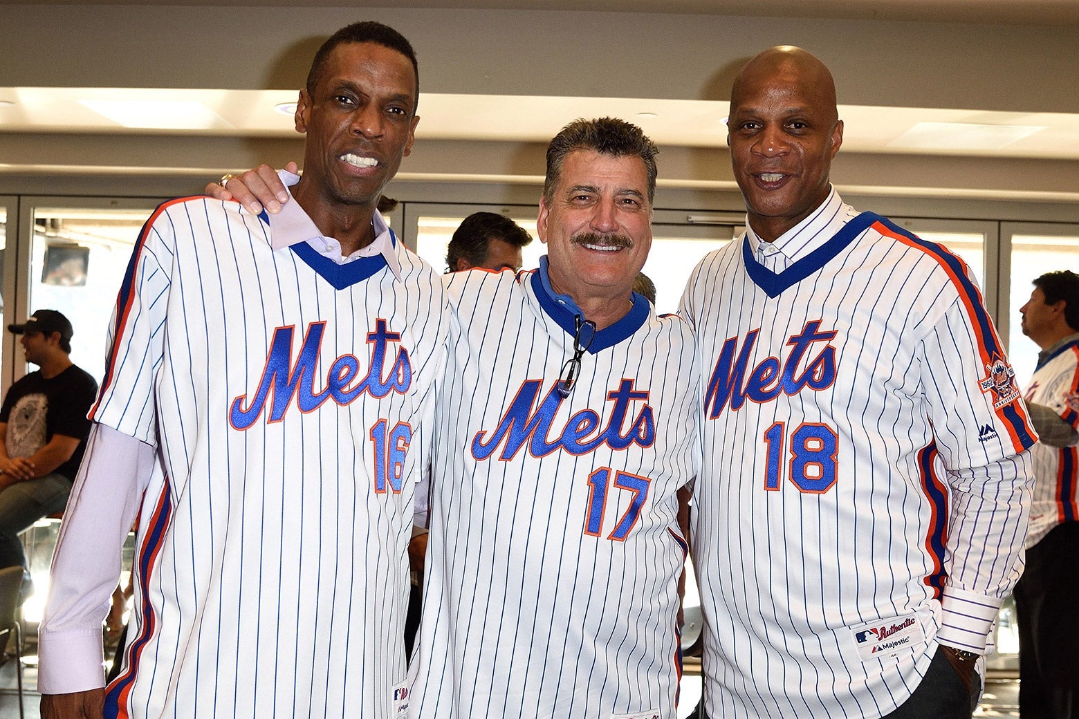 Dwight Gooden, Keith Hernandez, Darryl Strawberry smile while wearing Mets jerseys.