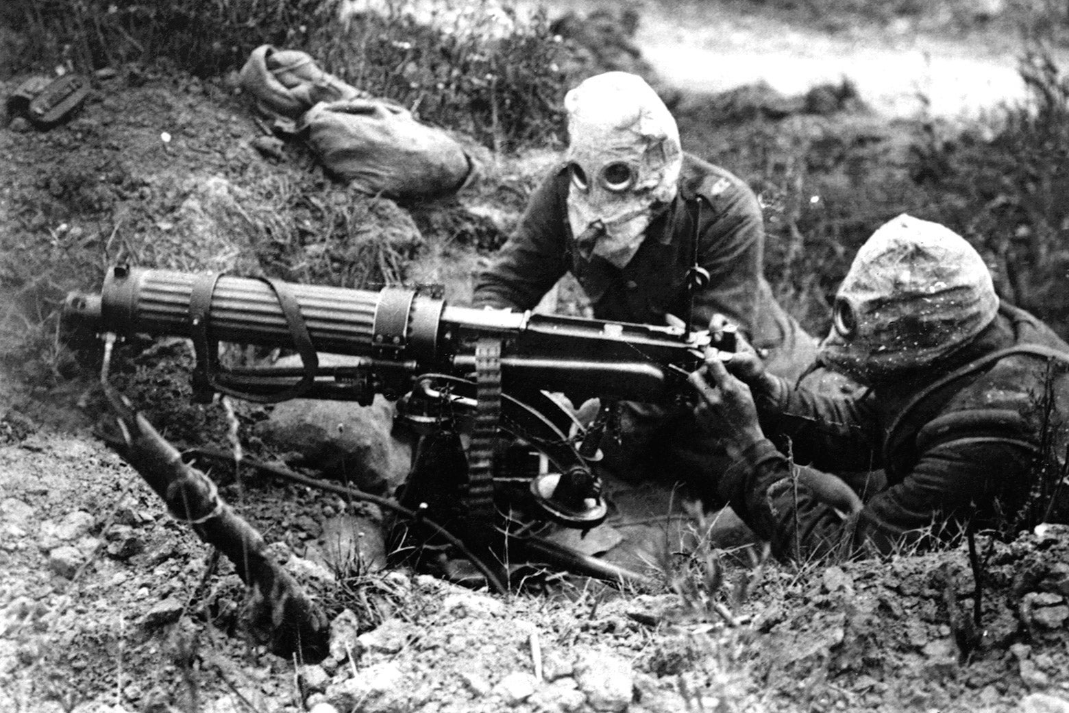 British machine gunners with gas masks on.