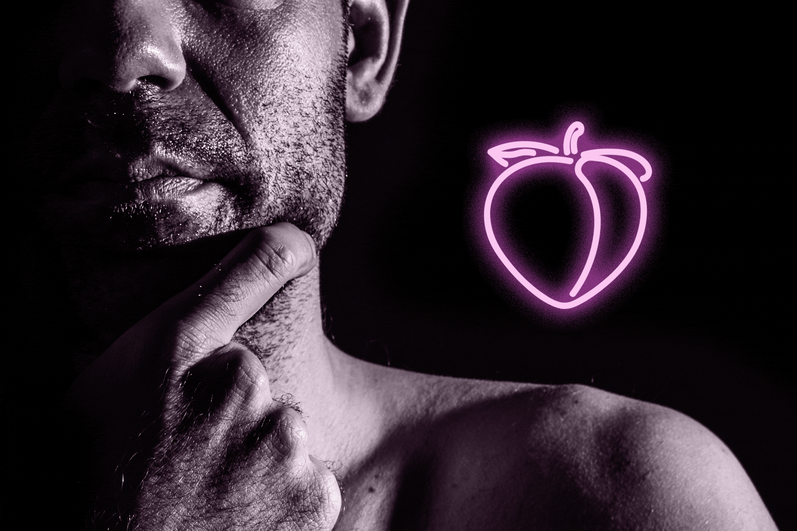 Man thinking next to a neon peach.