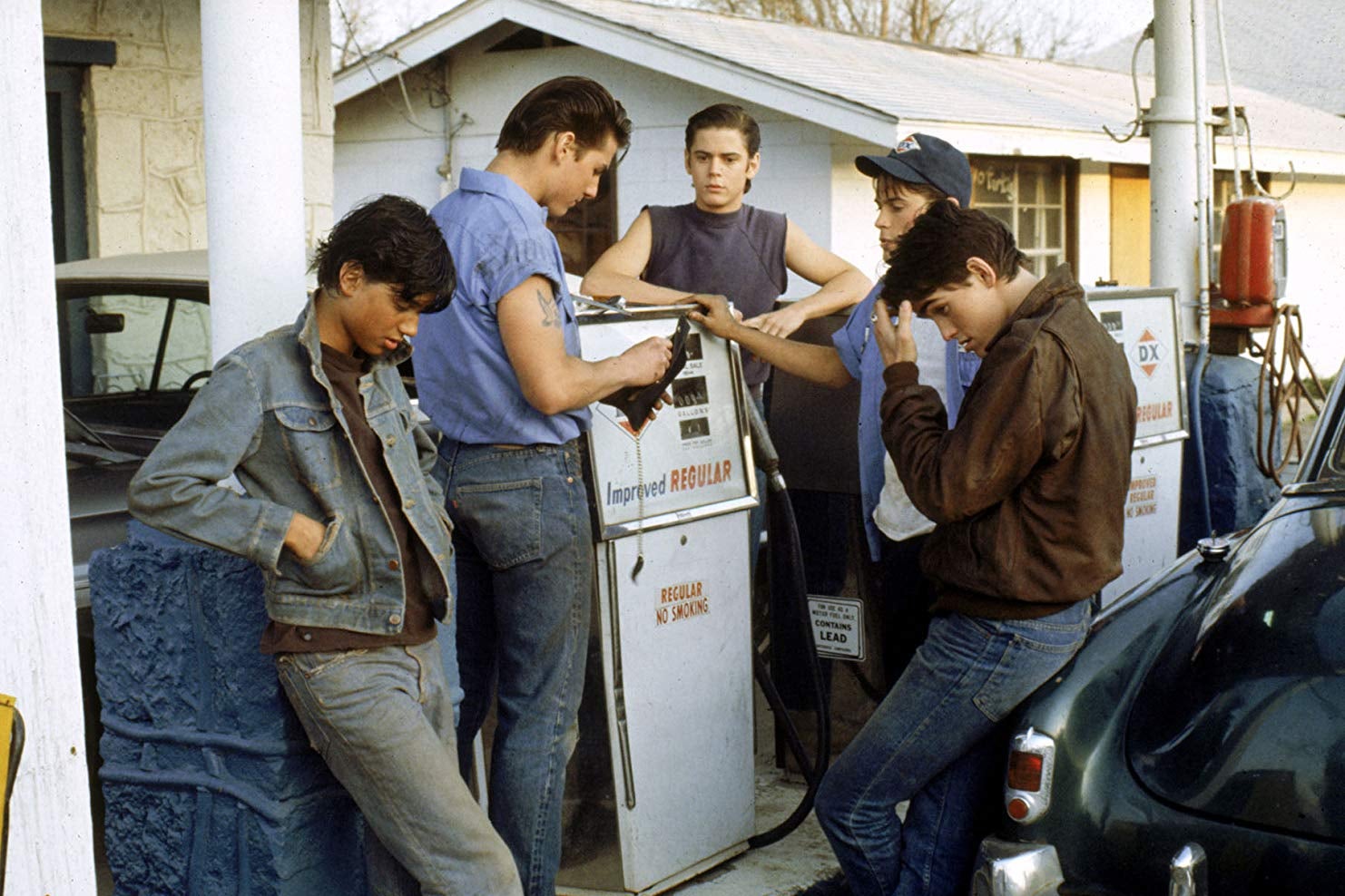 At a gas station: Tom Cruise, Matt Dillon, Rob Lowe, C. Thomas Howell, Ralph Macchio.