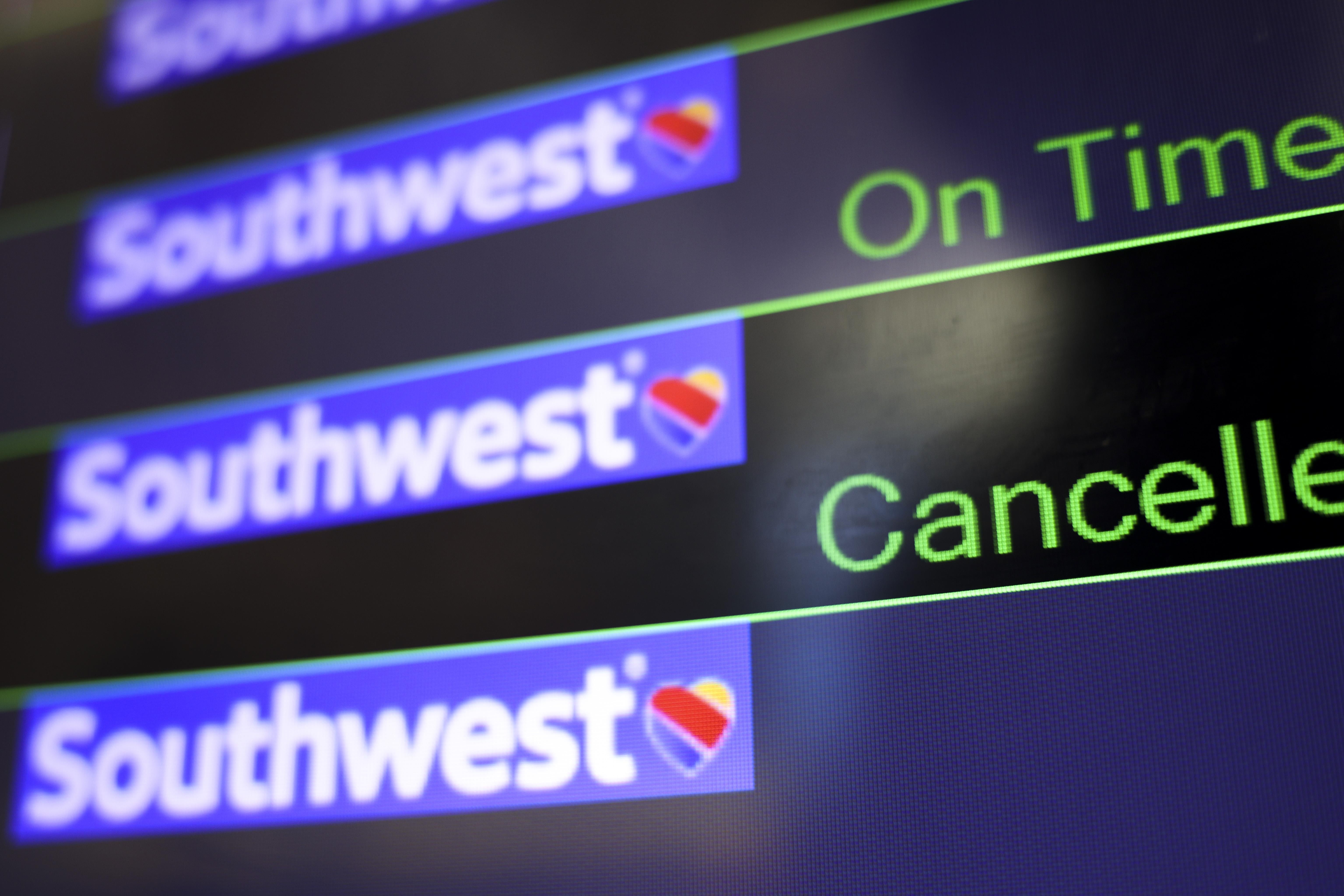 A screen displays Southwest Airlines flight information.