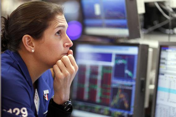 A trader works on the floor of the New York Stock Exchange August 19, 2011.